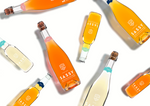 Bottles of Maison Sassy French Cider on White Background