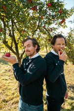 The founders of Maison Sassy eating cider apples